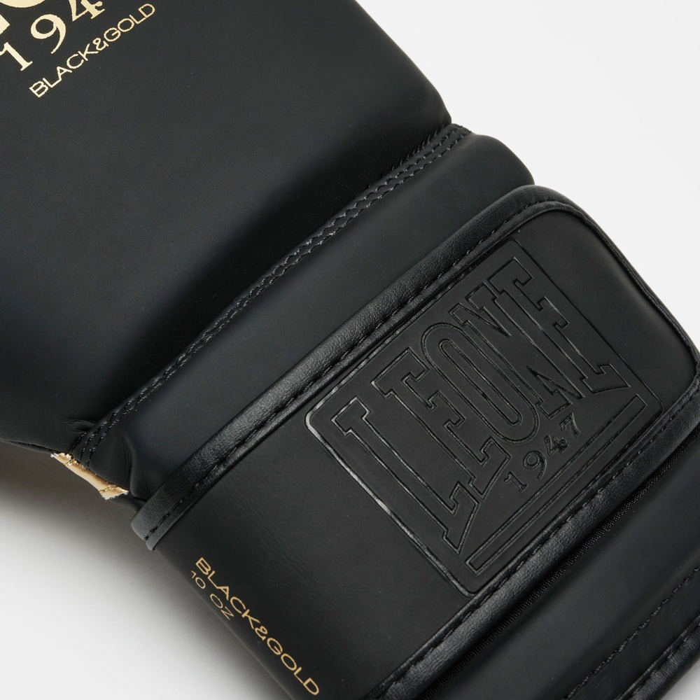 Боксерські рукавиці Leone GN059D Black/Gold 14 унцій